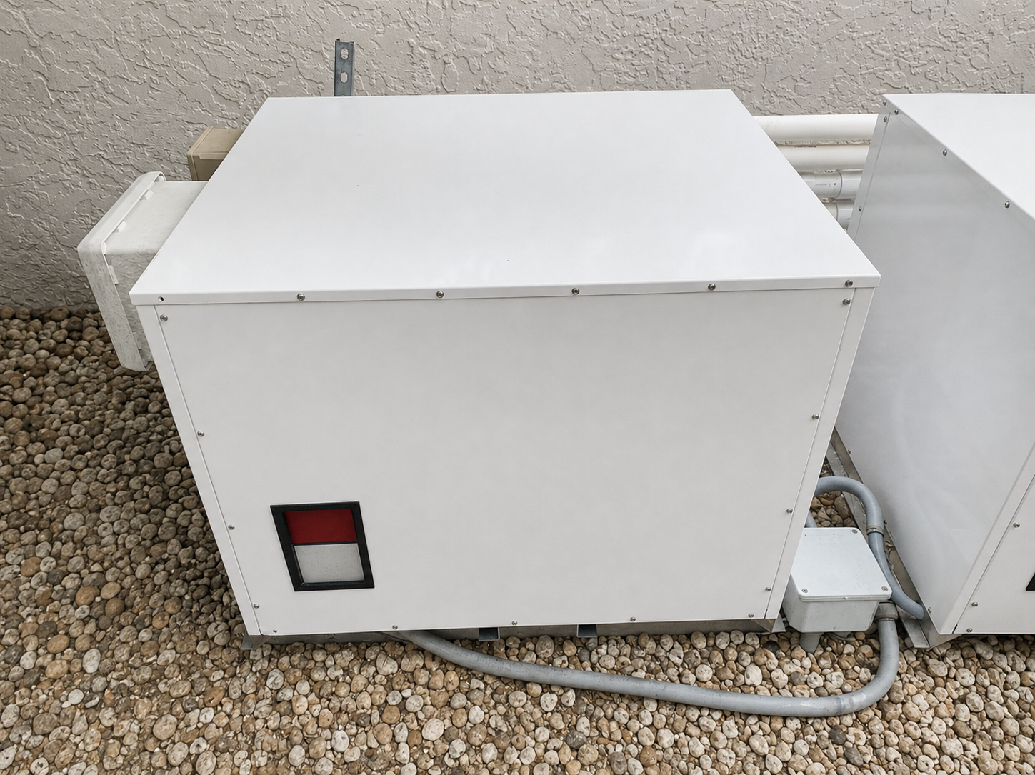 Brand-neutral water source pool heating equipment cabinet at a Florida property